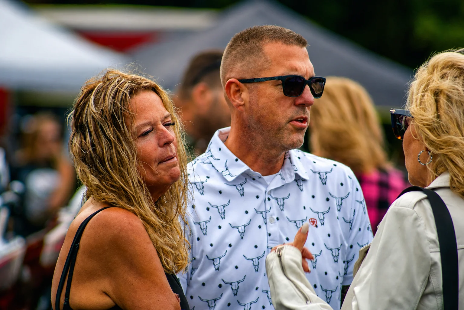 Bike Week visitors talking in the crowd