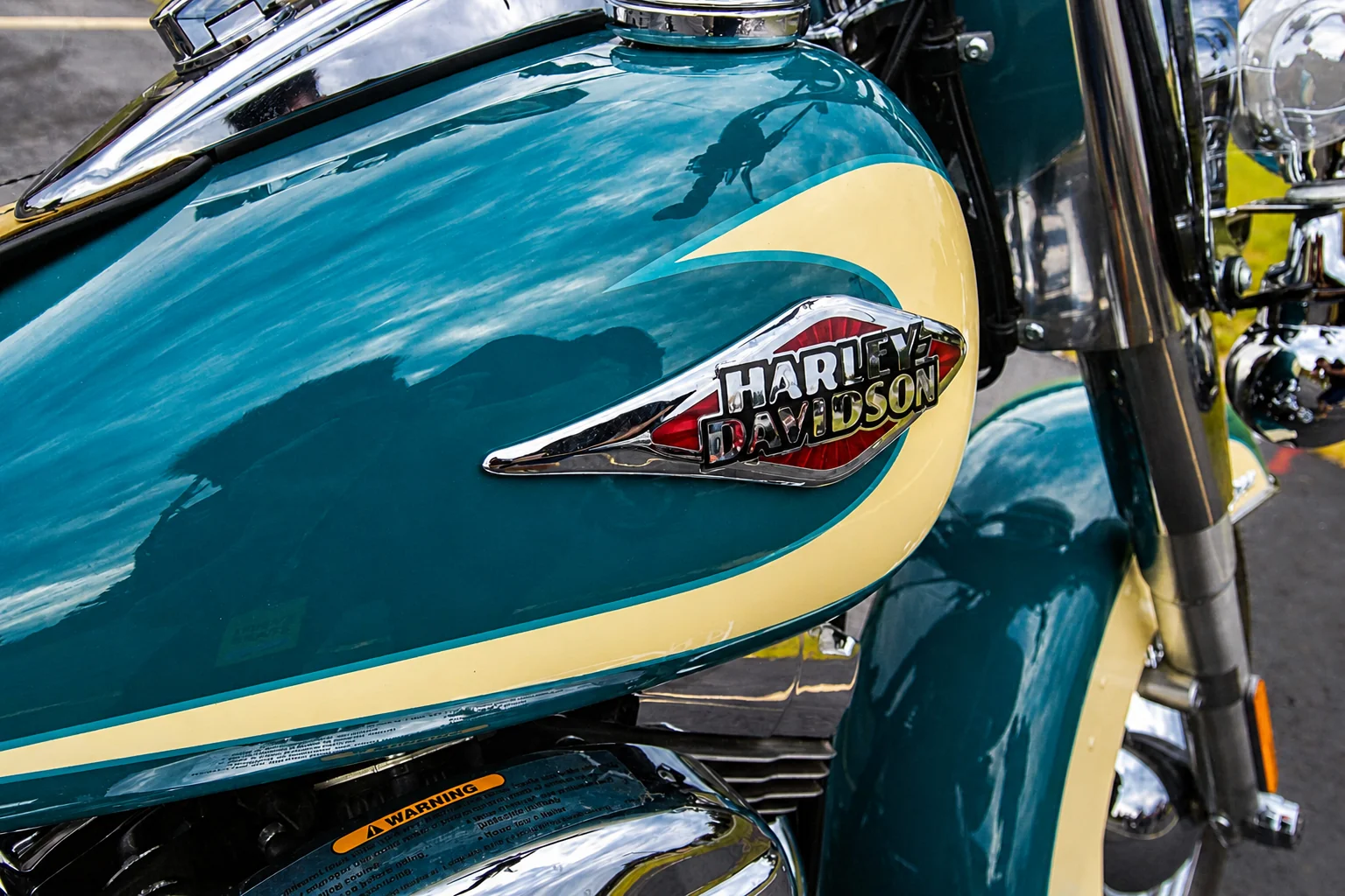 Close-up of a teal Harley-Davidson fuel tank